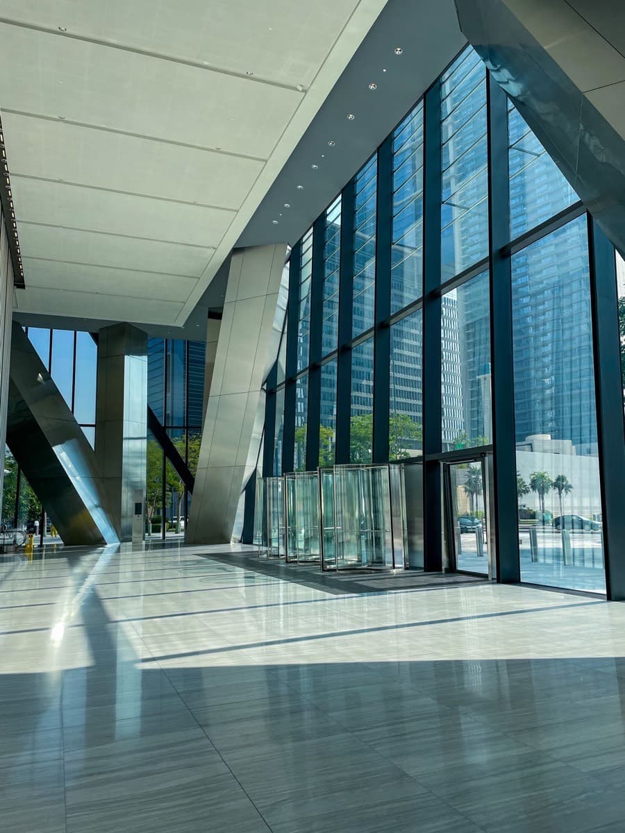 Modern glass office tower atrium and lobby