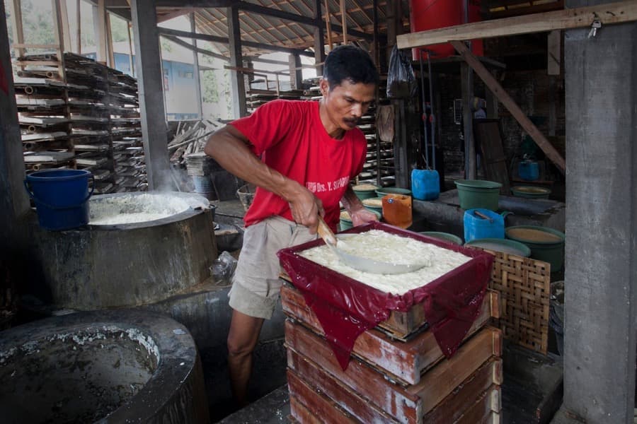 Indonesian small business owner working in a production workshop